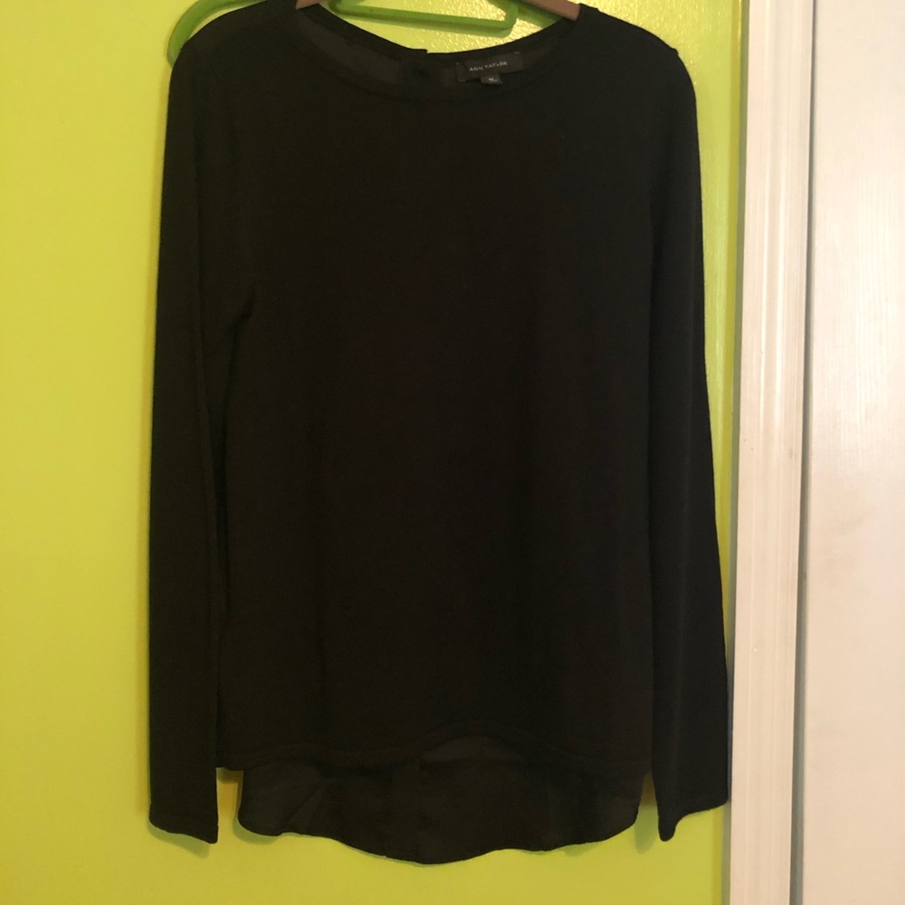 Black sweater with button detailing in the back